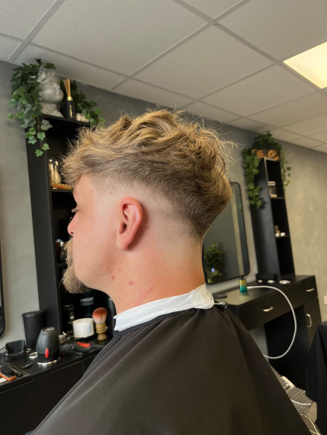 Blond textured crop with low drop fade, back view — haircut at STANDRD barbers, Leamington Spa